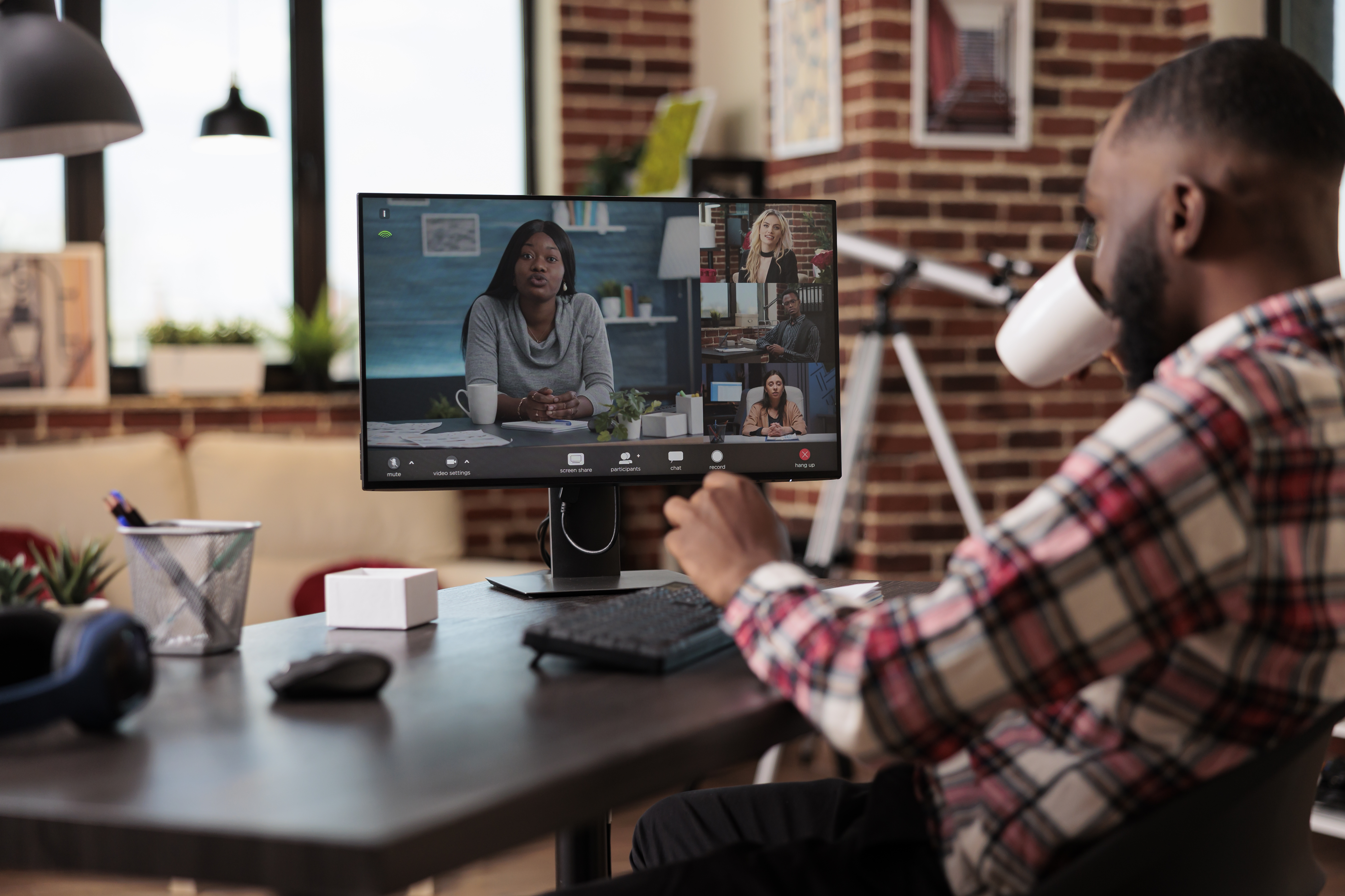 young-man-attending-business-videocall-meeting-with-people-using-computer-webcam-home-working-remotely-online-teleconference-call-talking-remote-videoconference-chat